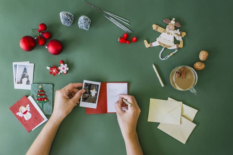 woman writing in christmas cards