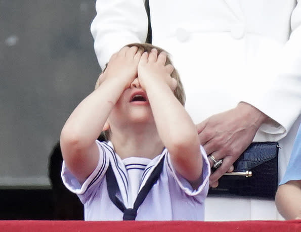 Prince Louis reacts on the balcony of Buckingham Palace, while viewing the Platinum Jubilee flypast, on day one of the Platinum Jubilee celebrations. Picture date: Thursday June 2, 2022.