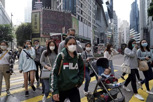 People wear masks on a street in Hong Kong