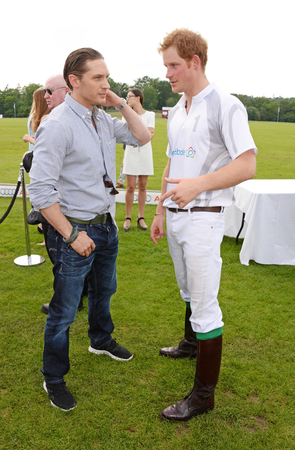 Tom Hardy and Prince Harry chat at the Audi Polo Challenge on June 1, 2014, in Ascot, England. (Photo: David M. Benett via Getty Images)