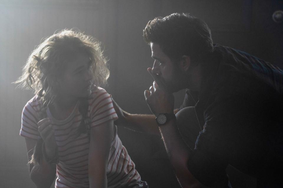 a quiet place part 2  millicent simmonds as regan and john krasinski as lee abbott