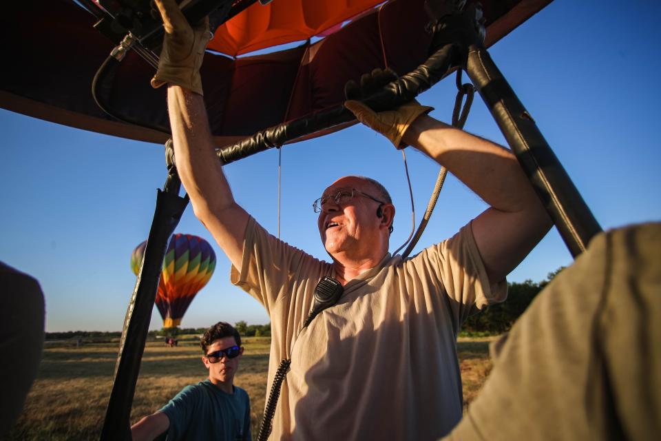 Gregg Sturge lands his hot-air balloon Fireball during the FireLake Fireflight Balloon Fest Thursday, Aug. 11, 2022, in Shawnee.