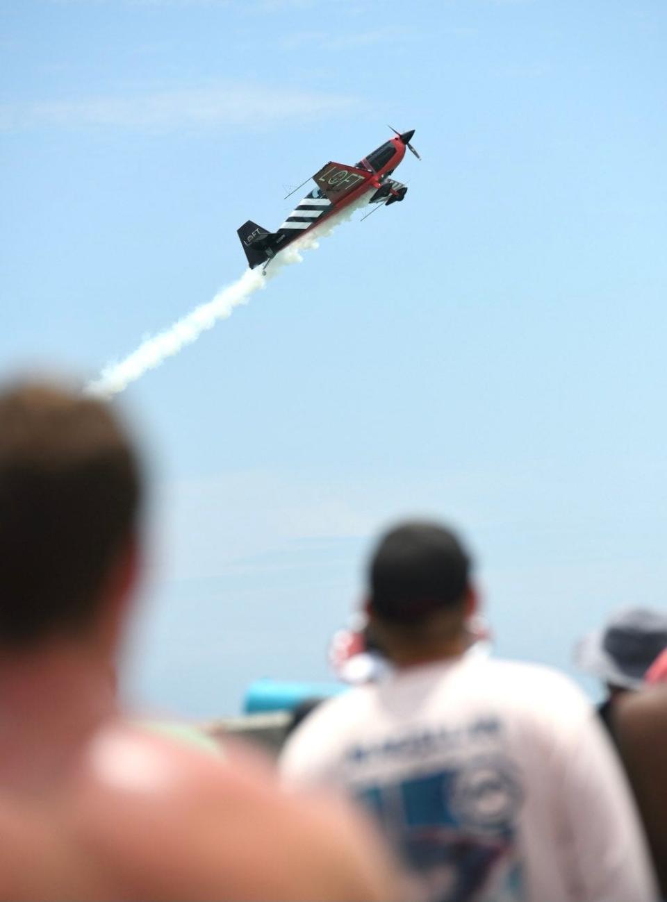 Military and civilian aviation acts take to the skies over Pensacola Beach on Friday during the annual Blue Angels Air Show.