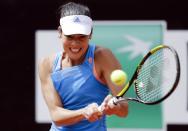 Ana Ivanovic of Serbia hits a return to Maria Sharapova of Russia during their women's singles match at the Rome Masters tennis tournament May 15, 2014. REUTERS/Max Rossi (ITALY - Tags: SPORT TENNIS)