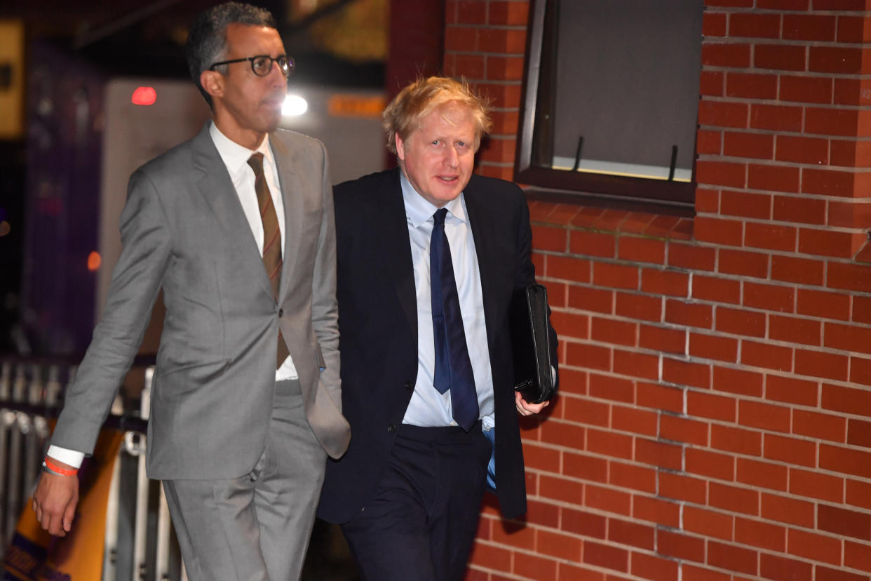 SHEFFIELD, UNITED KINGDOM - NOVEMBER 22:  British Prime Minister Boris Johnson walks with Editorial Director of BBC News Kamal Ahmed (L) as he arrives to take part in BBC Question Time leaders' special at The Octagon Centre on November 22, 2019 in Sheffield, England.  The leaders of the Conservatives, Labour, Liberal Democrats and the SNP will be taking part in the live General Election Question Time special, hosted by Fiona Bruce, and will each have 30 minutes to answer questions from the audience. (Photo by Anthony Devlin/Getty Images)