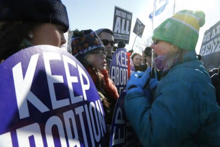 FILE PHOTO: An anti-abortion demonstrator (R) shouts at pro-choice demonstrators (L) in front of the U.S. Supreme Court during the annual March for Life in Washington, January 22, 2014.  REUTERS/Jonathan Ernst