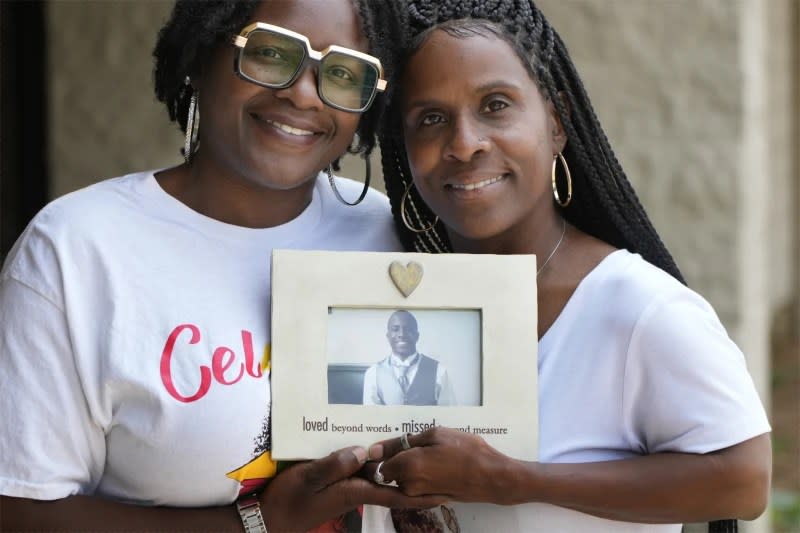 Daphne Myers, right, and her daughter, Latrice Gardner, hold a picture of Myers’ son and Gardner’s brother, Haston Myers Jr., on June 17, 2023, in Nashville, Tenn. (AP Photo/Mark Humphrey)