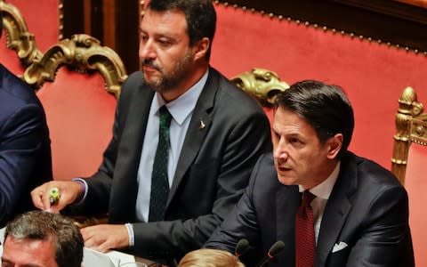 Italian Premier Giuseppe Conte, right, is flanked by Deputy-Premier Matteo Salvini as he addresses the Senate in Rome, Tuesday, Aug. 20, 2019. - Credit: Gregorio Borgia/AP