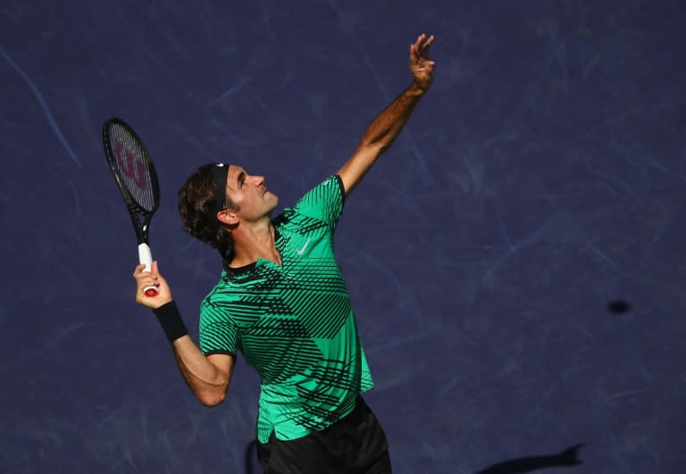 Roger Federer of Switzerland serves against Jack Sock of the United States in their semi final match during day thirteen of the BNP Paribas Open at Indian Wells Tennis Garden on March 18, 2017