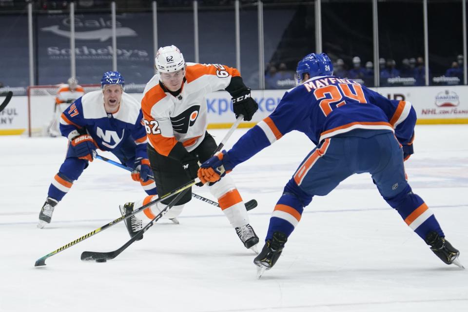 Philadelphia Flyers' Nicolas Aube-Kubel (62) shoots the puck past New York Islanders' Scott Mayfield (24) for a goal during the first period of an NHL hockey game Thursday, April 8, 2021, in Uniondale, N.Y. (AP Photo/Frank Franklin II)