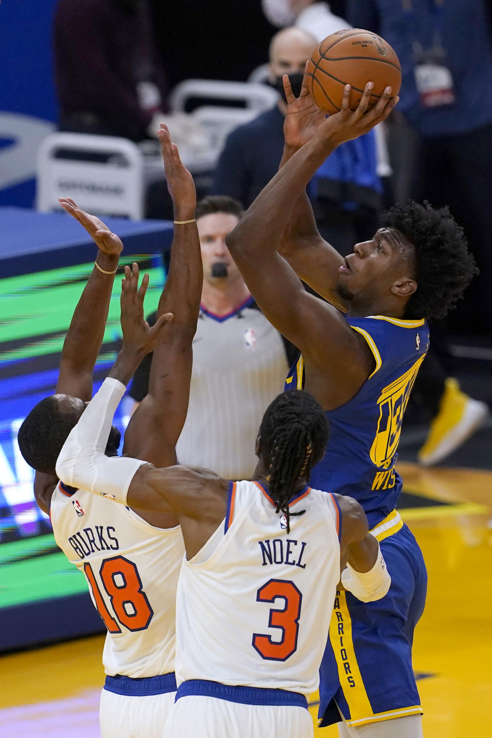Golden State Warriors center James Wiseman, right, shoots over New York Knicks guard Alec Burks (18) and center Nerlens Noel (3) during the first half of an NBA basketball game in San Francisco, Thursday, Jan. 21, 2021. (AP Photo/Jeff Chiu)