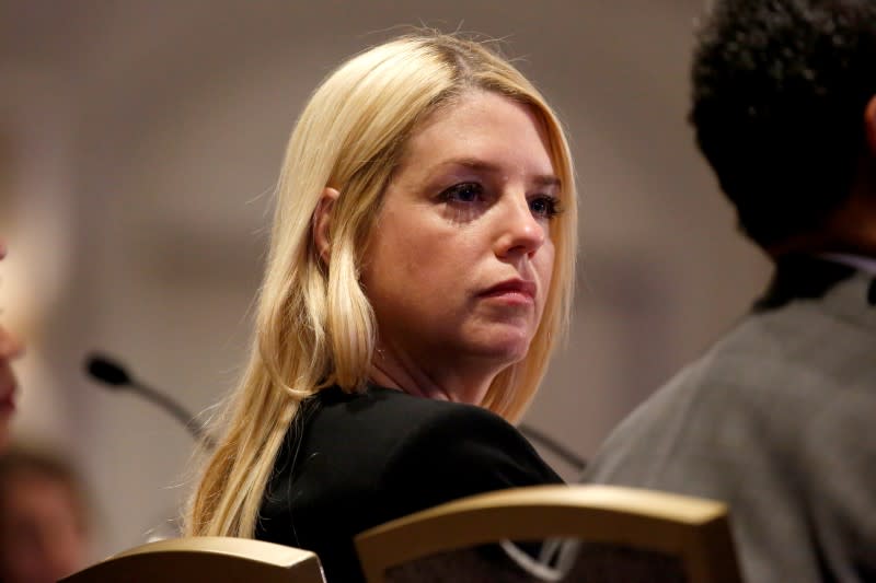 Florida Attorney General Pam Bondi listens to U.S. Attorney General Jeff Sessions as he speaks to the National Association of Attorneys General 2018 Winter Meeting in Washington