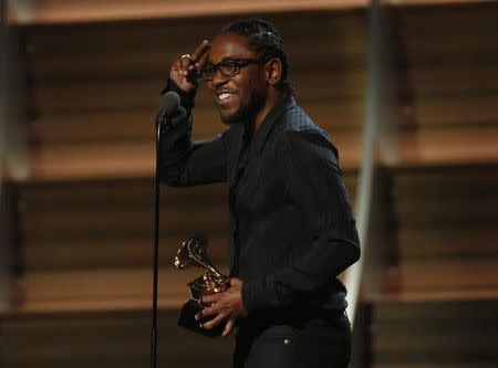 Kendrick Lamar accepts the award for Best Rap Album for "To Pimp A Butterfly" at the 58th Grammy Awards in Los Angeles, California February 15, 2016. REUTERS/Mario Anzuoni