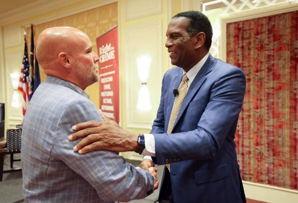 Dave Durocher, The Otherside Academy executive director, shakes hands with Rep. Burgess Owens, R-Utah, at The Dollars and Sense of Second Chance Hiring: A Utah Employer Engagement Forum, hosted by Right on Crime, at the Little America in Salt Lake City on Thursday, Aug. 24, 2023. | Kristin Murphy, Deseret News