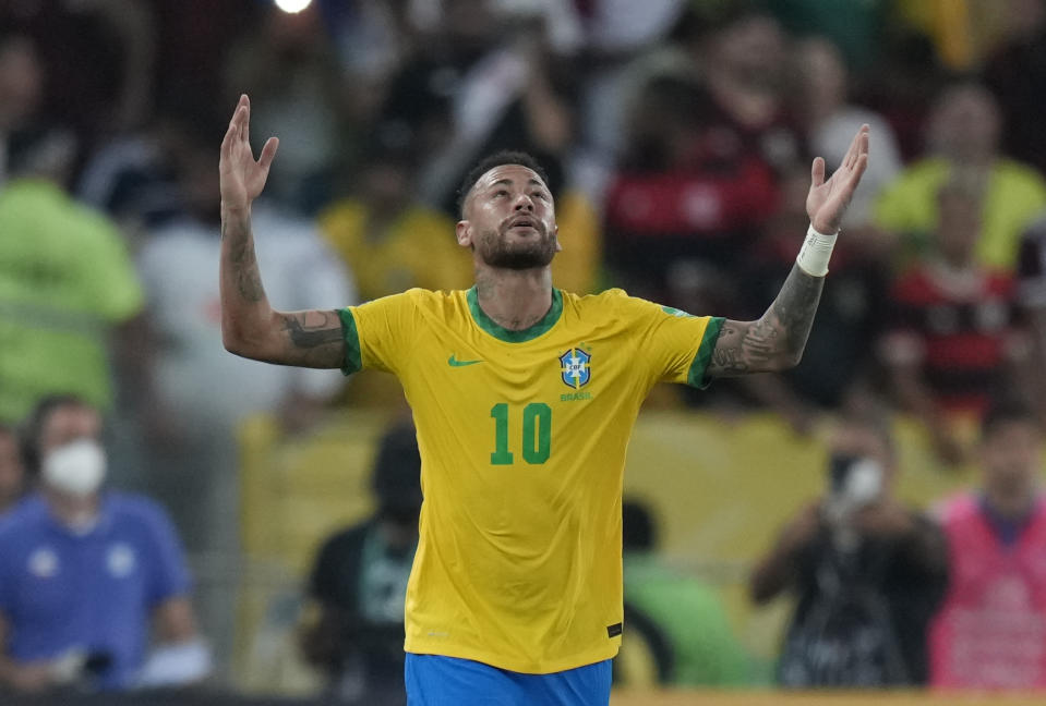Brazil's Neymar celebrates after scoring his side's opening goal from the penalty spot during a qualifying soccer match for the FIFA World Cup Qatar 2022 against Chile at Maracana stadium in Rio de Janeiro, Brazil, Thursday, March 24, 2022. (AP Photo/Silvia Izquierdo)