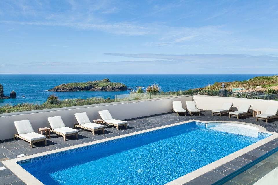 <p>Soak up the views over the South West Coast Path to the Atlantic at <a href="https://www.booking.com/hotel/gb/mullion-cove.en-gb.html?aid=2200763&label=hotels-outdoor-pools" rel="nofollow noopener" target="_blank" data-ylk="slk:Mullion Cove Hotel;elm:context_link;itc:0;sec:content-canvas" class="link ">Mullion Cove Hotel</a>, home to an outdoor pool overlooking the sea below. This elegant hotel is perched on a cliff just above Mullion Harbour, providing the pool terrace with magnificent views of the deep blue sea and Mullion Island.</p><p>The pool is just part of the hotel's wellness offerings, which include a chic spa (think VOYA and organic Cornish treatments, plus sea views from every space) and activities, such as sea-facing yoga sessions. </p><p>If you're looking for a Cornish hotel that embraces its location, this romantic bolthole with a dramatic Lizard Peninsula setting ticks all the boxes.</p><p><a class="link " href="https://www.booking.com/hotel/gb/mullion-cove.en-gb.html?aid=2200763&label=hotels-outdoor-pools" rel="nofollow noopener" target="_blank" data-ylk="slk:BOOK A ROOM;elm:context_link;itc:0;sec:content-canvas">BOOK A ROOM</a></p>