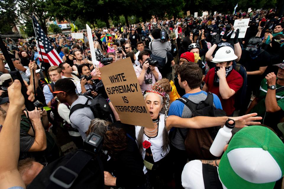 A counterprotester confronts members of the Proud Boys and other right-wing demonstrators during an "End Domestic Terrorism" rally in Portland, Ore., on Aug. 17, 2019.