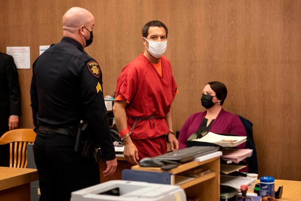 Scott Peterson leaves the courtroom after he is resentenced to life in prison without parole during a hearing at the San Mateo County Superior Court in Redwood City, Calif., Dec. 8, 2021. Peterson appeared in San Mateo Superior Court for the first time since he was sentenced to death there more than 17 years ago for the murders of his wife Laci and their unborn son Conner. (POOL-Andy Alfaro,The Modesto Bee)