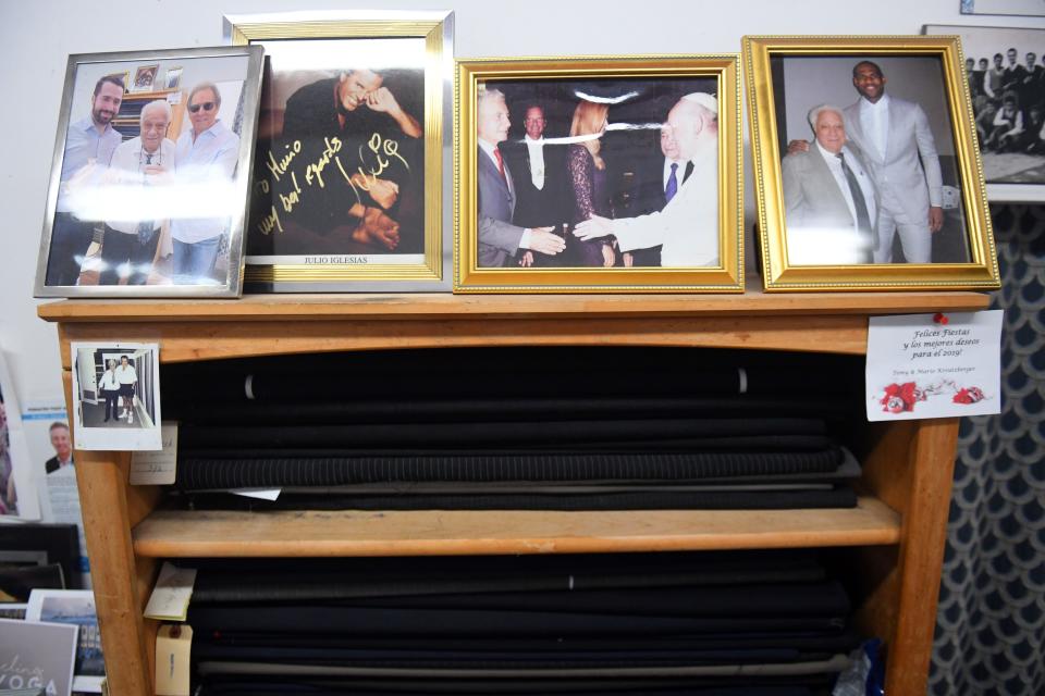 Photographs adorn the small tailor shop of Mario Vita in Surfside. Some of Vita's clients include Julio Iglesias and LeBron James. Vita has been operating the shop for 40 years.