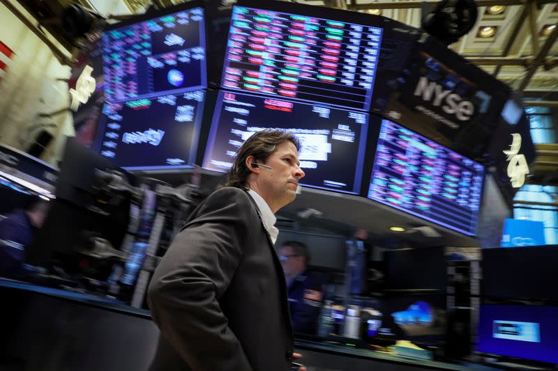 Traders work on the floor of the NYSE in New York