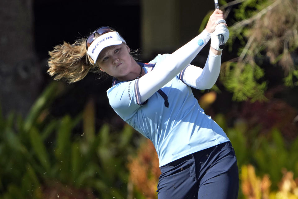 Brooke M. Henderson, of Canada, hits her second shot from the first fairway during the first round of the LPGA CME Group Tour Championship golf tournament, Thursday, Nov. 17, 2022, at the Tiburón Golf Club in Naples, Fla. (AP Photo/Lynne Sladky)