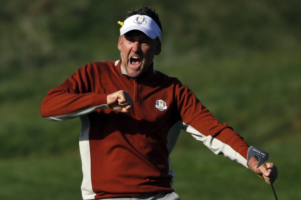 Europe's Ian Poulter celebrates after Wwinning the 7th hole during his fourball match on the second day of the 2018 Ryder Cup at Le Golf National in Saint Quentin-en-Yvelines, outside Paris, France, Saturday, Sept. 29, 2018. (AP Photo/Francois Mori)