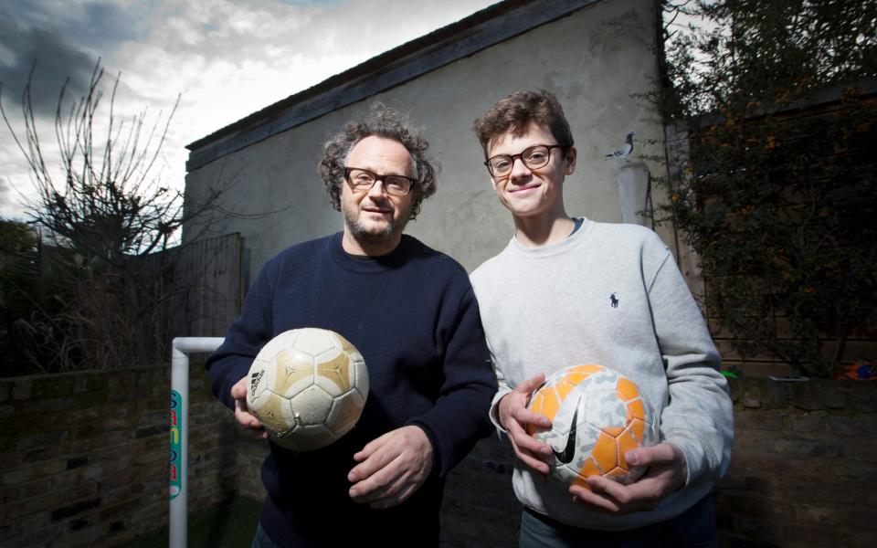 Author James Brown and his son Marlais share a love of football - Jeff GIlbert