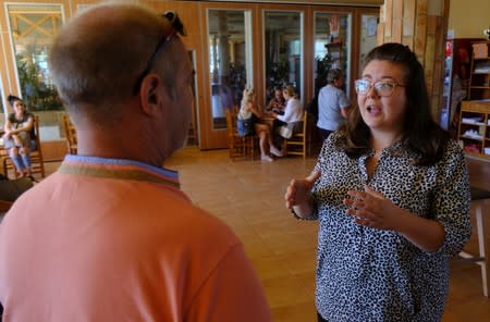 Insurance broker Sophie Goode informs British residents about health care insurance after upcoming Brexit in Benidorm