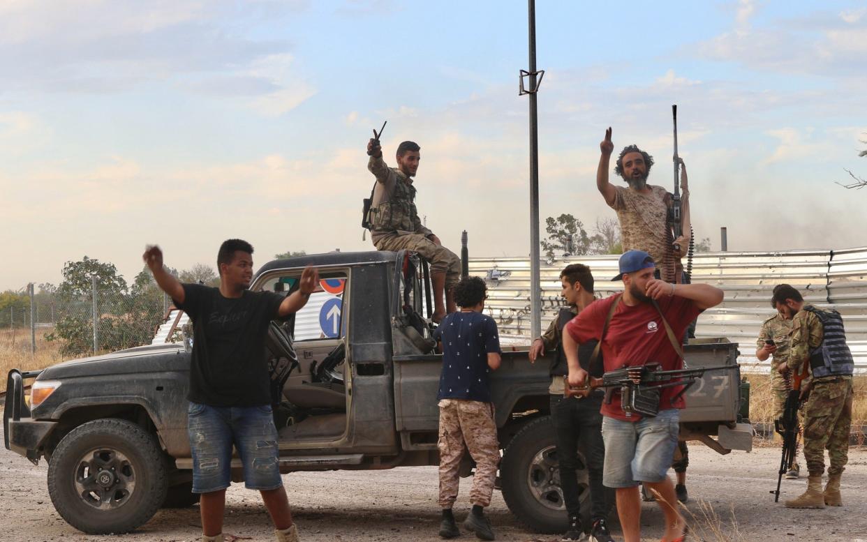 Pro-GNA fighters celebrate after capturing Tripoli airport on June 3 - Hazem Turkia/ Anadolu Agency