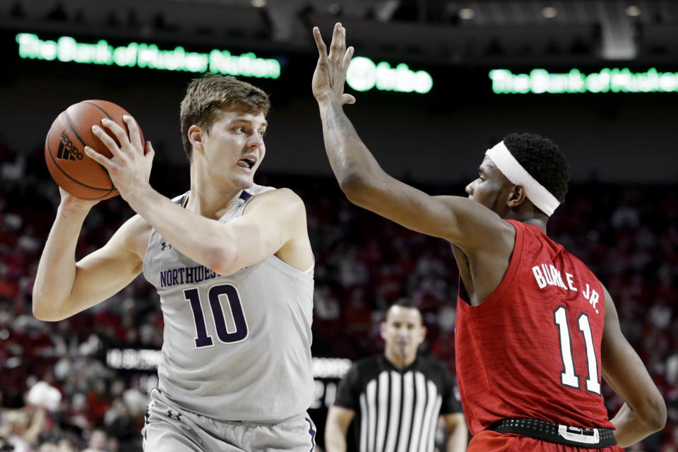 Northwestern's Miller Kopp (10) looks to pass against Nebraska's Dachon Burke Jr. (11) during the first half of an NCAA college basketball game in Lincoln, Neb., Sunday, March 1, 2020. (AP Photo/Nati Harnik)