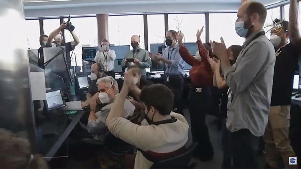 Engineers in the Mission Operations Center at the Space Telescope Science Institute in Baltimore burst into cheers with confirmation Webb's right-side mirror pallet had been locked in place after rotating into position, the final step in a complex series of critical deployments. / Credit: NASA TV