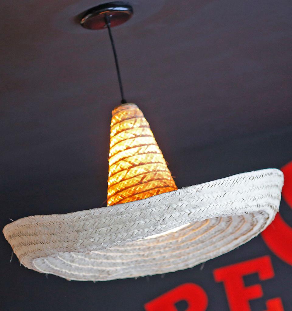 Hanging sombrero lights are one of many festive features at the South Shore Taco Guy restaurant in Hull.