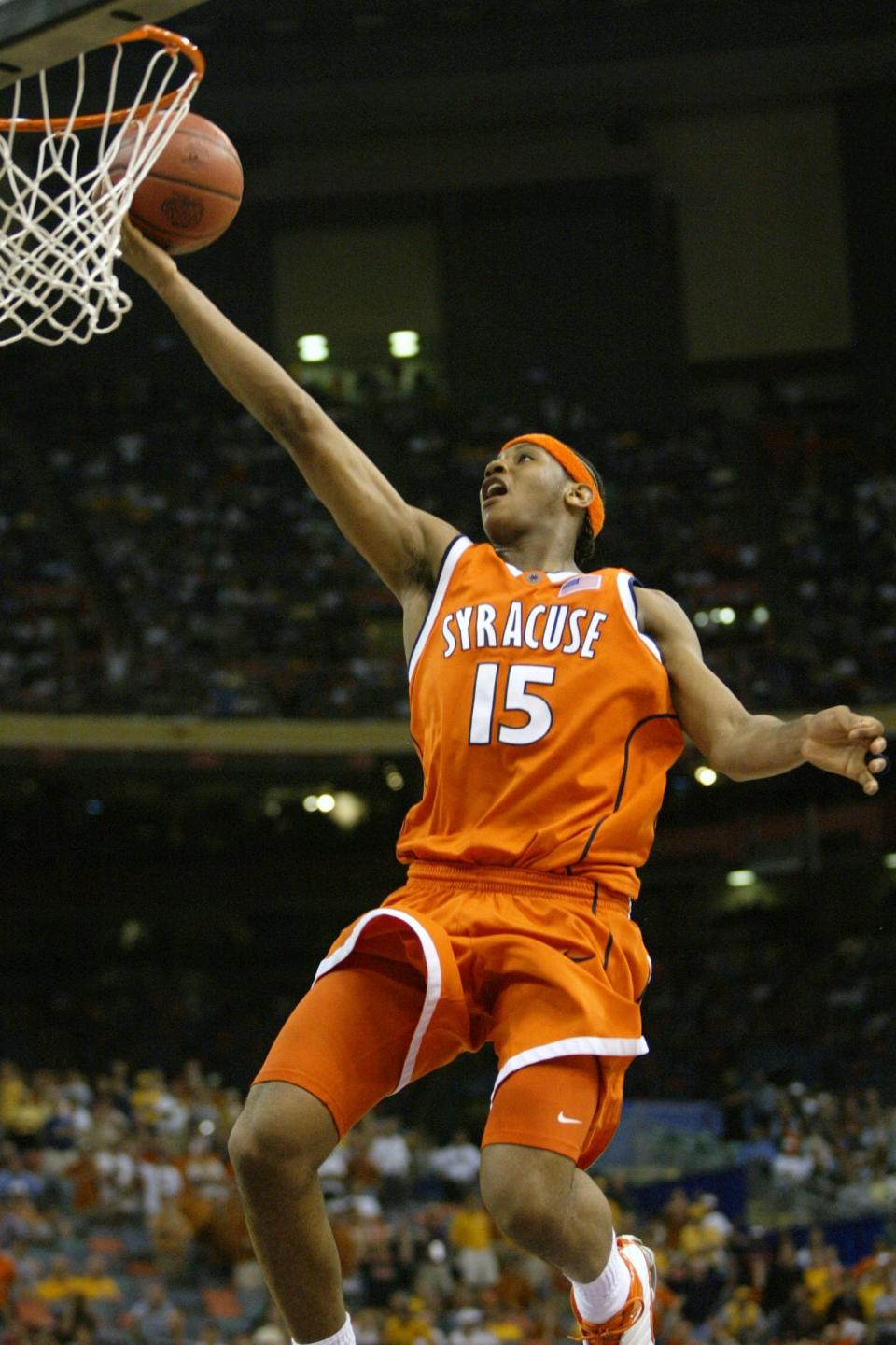 Syracuse's Carmelo Anthony puts up a layup in the closing seconds of the Orangemen's 95-84 win over Rick Barnes' Texas Longhorns on April 5, 2003. That Final Four also featured Dwyane Wade with Marquette. (AP Photo/Michael Conroy, File)