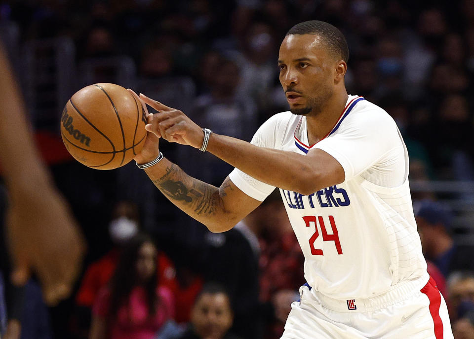 LOS ANGELES, CALIFORNIA - FEBRUARY 06:  Norman Powell #24 of the Los Angeles Clippers dribbles the ball against the Milwaukee Bucks in the fourth quarter at Crypto.com Arena on February 06, 2022 in Los Angeles, California.  NOTE TO USER: User expressly acknowledges and agrees that, by downloading and/or using this Photograph, user is consenting to the terms and conditions of the Getty Images License Agreement.  (Photo by Ronald Martinez/Getty Images)