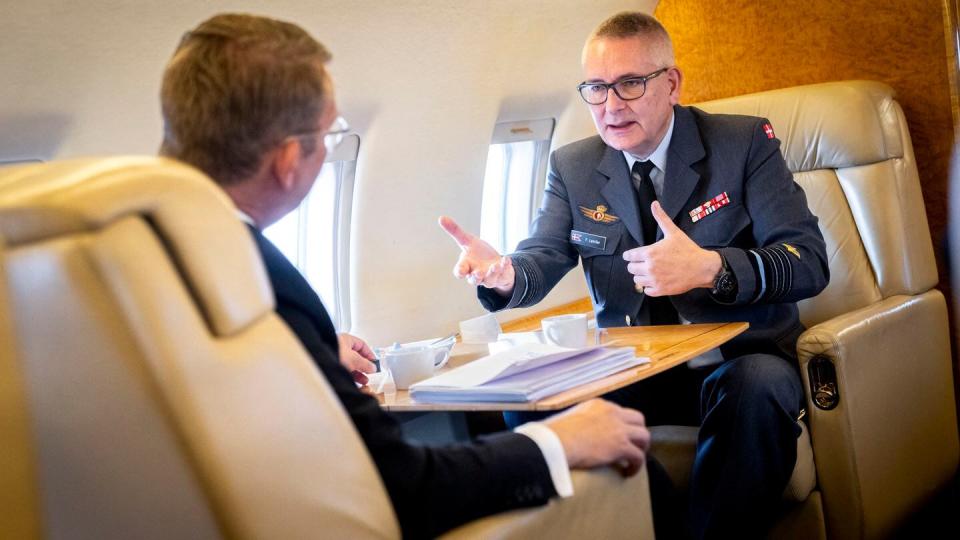 Danish Defence Minister Troels Lund Poulsen, left, and then-Danish Chief of Defence Flemming Lentfer talk on a plane on Sept. 19, 2023. (Ida Marie Odgaard/Ritzau Scanpix/AFP via Getty Images)