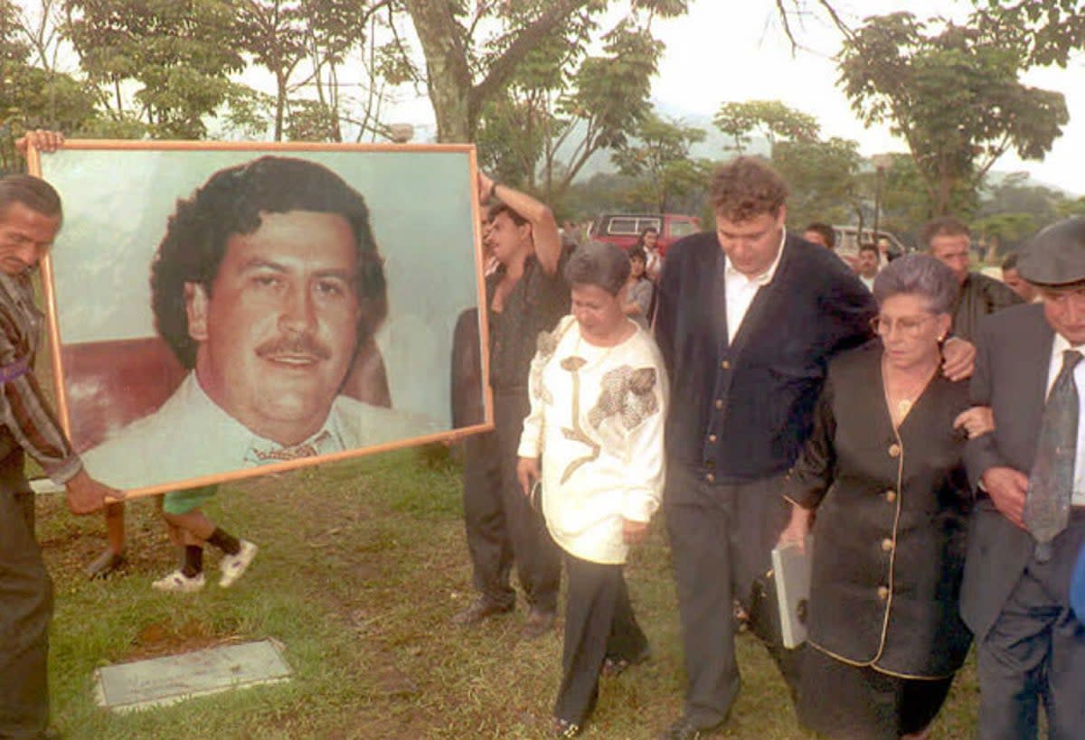 Hermilda de Escobar, mother of Medellin drug cartel kingpin Pablo Escobar, walks with friends and relatives to Escobar’s tomb for the first anniversary of his death (AFP/GETTY IMAGES)