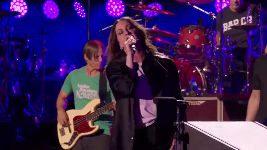 Alanis Morissette, who gave Taylor Hawkins his first real gig as a musician, performs at a tribute concert for the late drummer in Los Angeles.