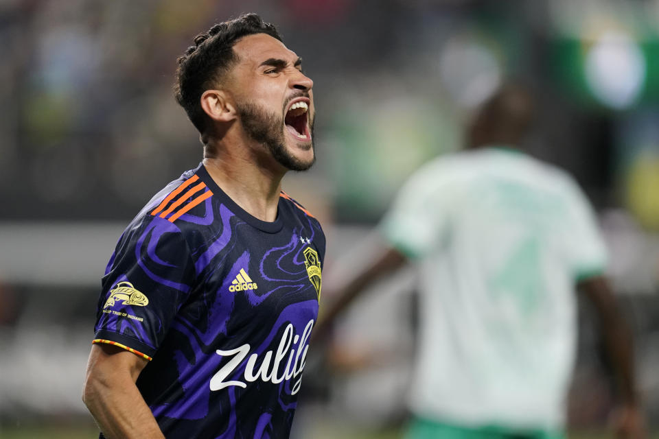 Seattle Sounders' Cristian Roldan (7) celebrates after scoring against Club Leon during the second half of the Leagues Cup soccer final Wednesday, Sept. 22, 2021, in Las Vegas. (AP Photo/John Locher)