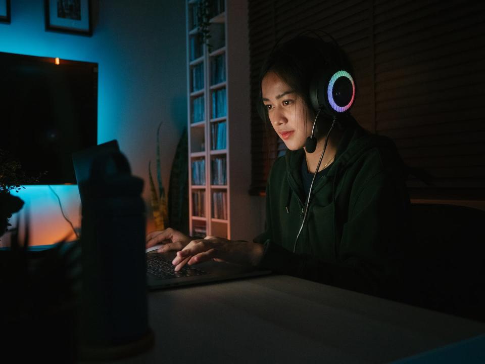 Asian American teens often face racism and bullying online. <a href="https://www.gettyimages.com/detail/photo/asian-young-woman-playing-online-games-on-laptop-royalty-free-image/1249868515" rel="nofollow noopener" target="_blank" data-ylk="slk:staticnak1983/E+ via Getty Images;elm:context_link;itc:0;sec:content-canvas" class="link ">staticnak1983/E+ via Getty Images</a>