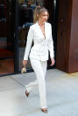 <p>Model Gigi Hadid was spotted strolling around town in a fierce white suit on October 23 with a glitzy teddy Judith Leiber bag to finish. <em>[Photo: Getty]</em> </p>