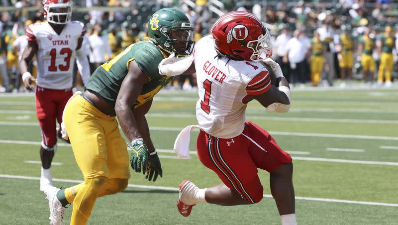 Utah running back Jaylon Glover scores a touchdown past Baylor linebacker Brooks Miller in the second half of an NCAA college football game, Saturday, Sept. 9, 2023, in Waco, Texas.