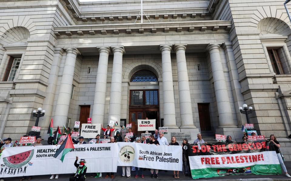 People picket outside the Western Cape High court for the success of the South African Government's genocide case