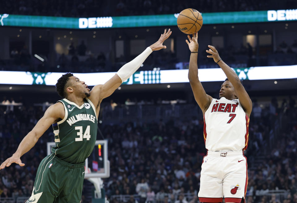 Miami Heat guard Kyle Lowry (7) makes a 3-pointer against Milwaukee Bucks forward Giannis Antetokounmpo (34) during the first half of Game 5 in a first-round NBA basketball playoff series Wednesday, April 26, 2023, in Milwaukee. (AP Photo/Jeffrey Phelps)