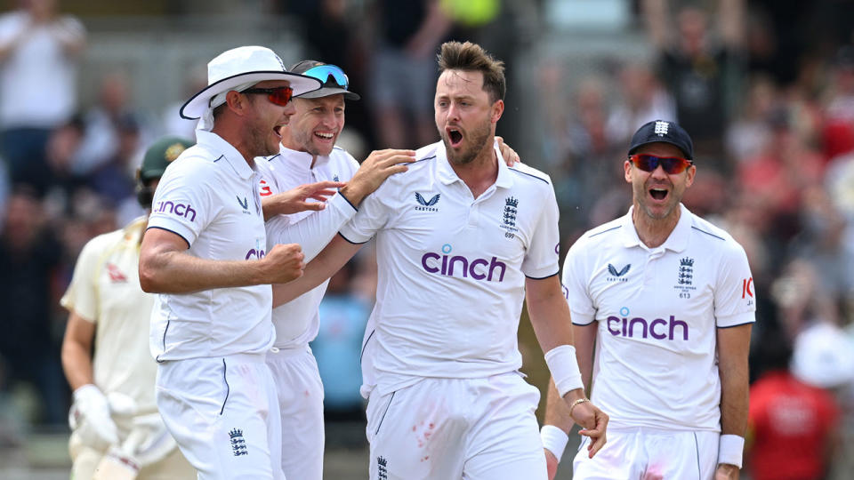 Seen here, England cricket star Ollie Robinson celebrates with teammates in the Ashes.