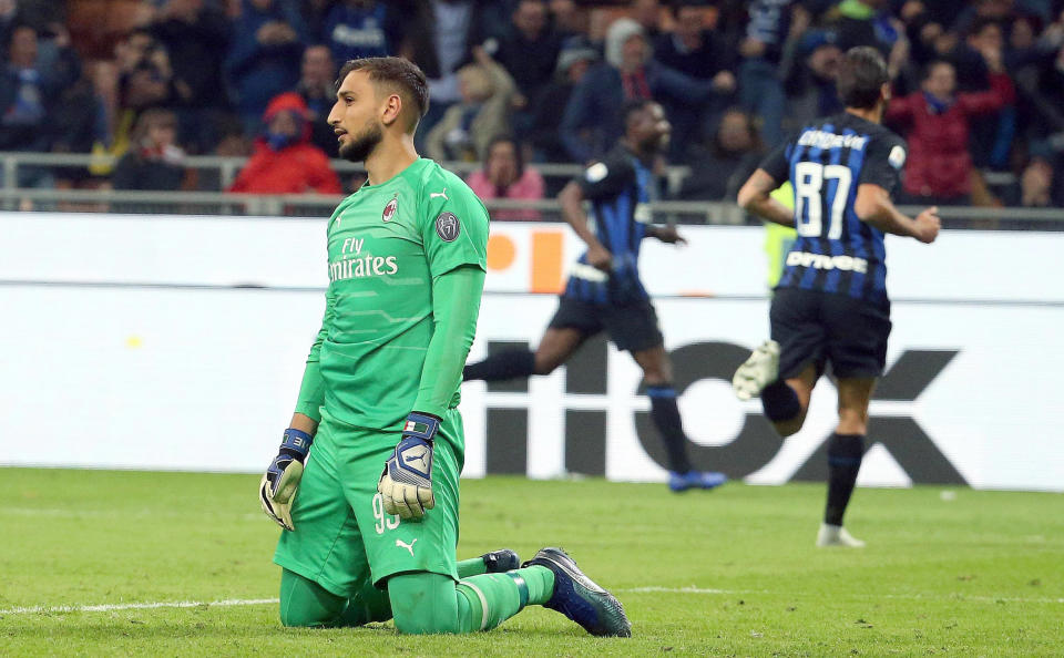 AC Milan goalkeeper Gianluigi Donnarumma reacts at the end of the Serie A soccer match between Inter Milan and AC Milan at the San Siro Stadium in Milan, Italy, Sunday, Oct. 21 2018. Mauro Icardi's stoppage-time header gave Inter Milan a 1-0 win over AC Milan in the city derby on Sunday. (Matteo Bazzi/ANSA via AP)