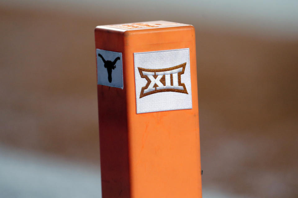 FILE - In this Sept. 15, 2018, file photo, the Big 12 conference logo is seen on a pylon during the first half of an NCAA college football game between Texas and USC in Austin, Texas. Texas and Oklahoma made a request Tuesday, July 27, 2021, to join the Southeastern Conference — in 2025 —- with SEC Commissioner Greg Sankey saying the league would consider it in the “near future.” (AP Photo/Eric Gay, File)