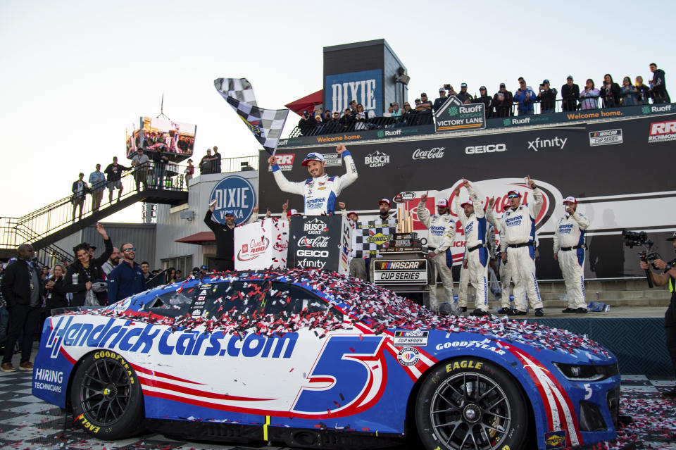 Kyle Larson (5) celebrates in Victory Lane after winning a NASCAR Cup Series auto race at Richmond Raceway, Sunday, April 2, 2023, in Richmond, Va. (AP Photo/Mike Caudill)