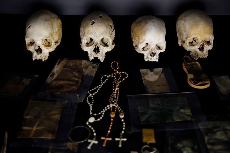 FILE PHOTO: Skulls and personal items of victims of the Rwandan genocide are seen as part of a display at the Genocide Memorial in Gisozi in Kigali