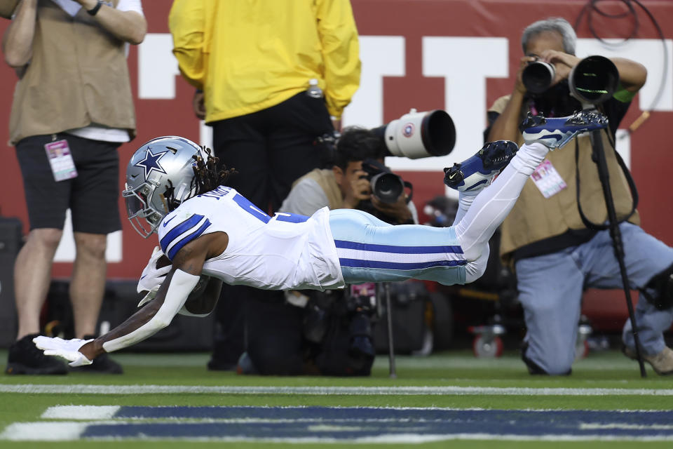 Dallas Cowboys wide receiver KaVontae Turpin falls into the end zone after catching a touchdown pass during the first half of an NFL football game against the San Francisco 49ers in Santa Clara, Calif., Sunday, Oct. 8, 2023. (AP Photo/Jed Jacobsohn)