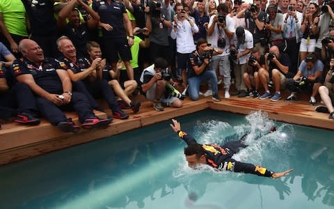 Race winner Daniel Ricciardo of Australia and Red Bull Racing celebrates with a swan dive into the swimming pool of the Red Bull Energy Station after the Monaco Formula One Grand Prix at Circuit de Monaco on May 27, 2018 in Monte-Carlo, Monaco - Credit: Getty Images